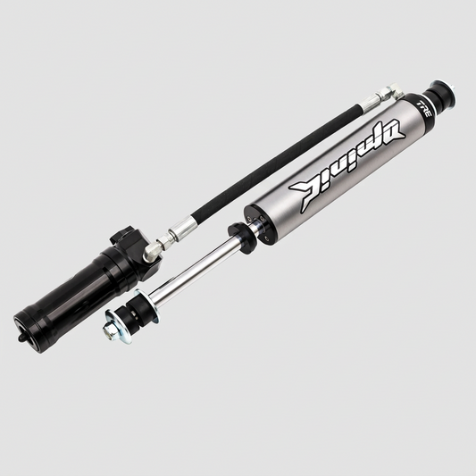 Two shock absorbers on a white background with a brand logo.